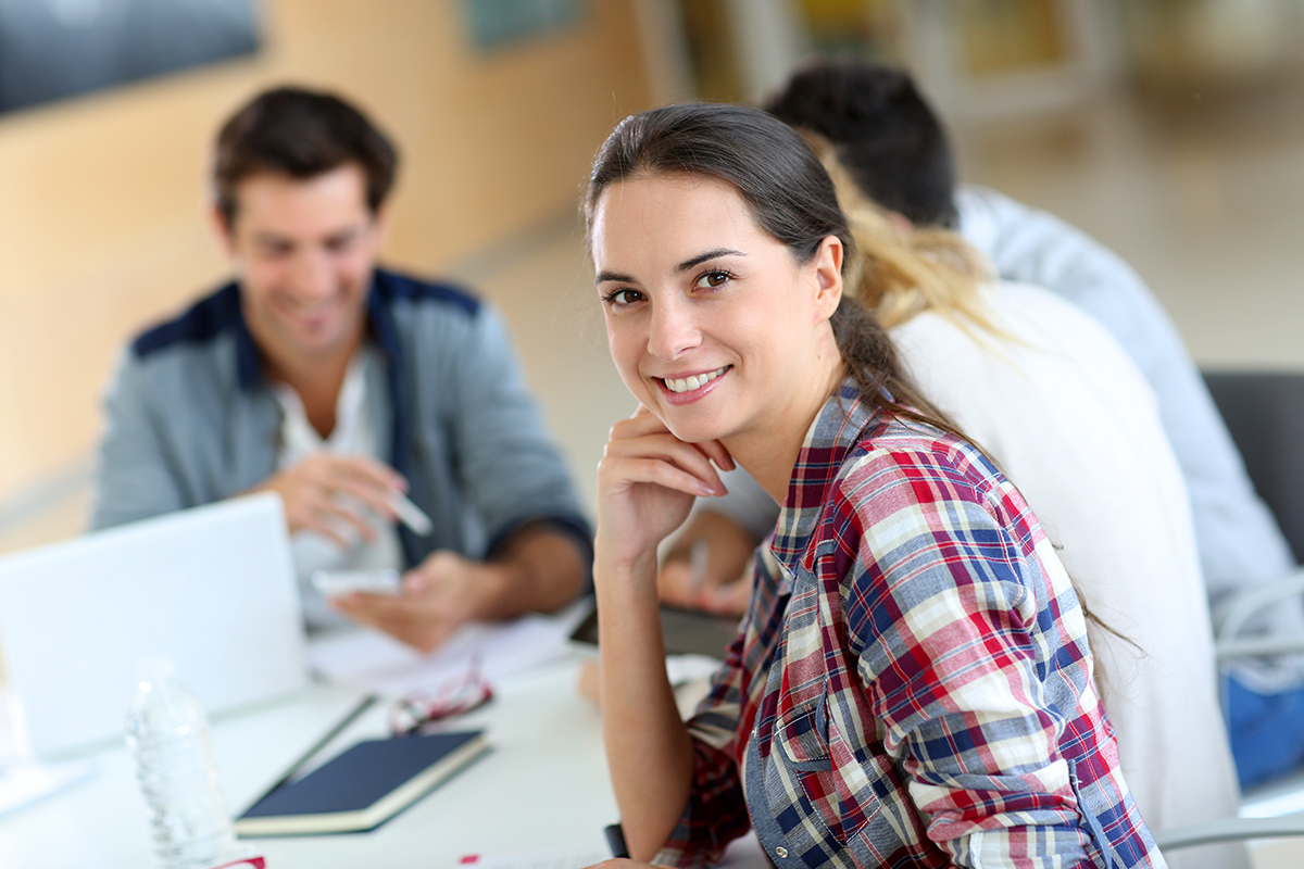 Cheerful young woman at university